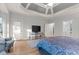 Lovely main bedroom boasts trey ceilings, hardwood floors, and neutral paint at 519 River Estates Pkwy, Canton, GA 30115