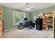 Bedroom converted to office featuring natural light, neutral paint and built-in shelving at 519 River Estates Pkwy, Canton, GA 30115