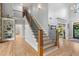Beautiful staircase with wood and iron railings and lots of natural light at 519 River Estates Pkwy, Canton, GA 30115