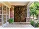 Close up of a home's exterior stone facade that includes a unique water feature element at 519 River Estates Pkwy, Canton, GA 30115