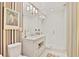 Bathroom with vertical striped wall paper, marble countertops, and a glass shower at 1820 Peachtree Nw St # 1008, Atlanta, GA 30309