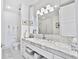 Bright bathroom featuring a double marble vanity and glass shower at 1820 Peachtree Nw St # 1008, Atlanta, GA 30309
