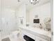 Bathroom featuring a vanity with a marble countertop, walk-in shower, and modern fixtures at 1820 Peachtree Nw St # 1008, Atlanta, GA 30309