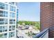 Balcony view of the city skyline and neighborhood with lots of trees at 1820 Peachtree Nw St # 1008, Atlanta, GA 30309