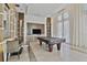 Game room features a billiard table with modern decor and large windows letting in natural light at 1820 Peachtree Nw St # 1008, Atlanta, GA 30309
