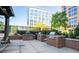 Outdoor grilling area featuring stainless steel grills, brick surrounds, and a concrete patio, great for entertaining guests at 1820 Peachtree Nw St # 1008, Atlanta, GA 30309