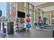 Fully equipped gym featuring weight machines, medicine balls and rowing machines at 1820 Peachtree Nw St # 1008, Atlanta, GA 30309