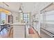 Modern kitchen with stainless steel appliances, white cabinetry, and a kitchen island with dining space at 1820 Peachtree Nw St # 1008, Atlanta, GA 30309