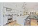 Bright kitchen featuring stainless steel appliances, breakfast bar with seating, and ample cabinet space at 1820 Peachtree Nw St # 1008, Atlanta, GA 30309