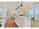 Spacious eat-in kitchen with a long granite island, stainless appliances, and open layout to the living room at 1820 Peachtree Nw St # 1008, Atlanta, GA 30309