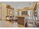 Entertaining area with cozy seating near the fireplace and a kitchenette featuring an island at 1820 Peachtree Nw St # 1008, Atlanta, GA 30309