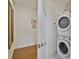 Convenient laundry room featuring stacked washer and dryer units, and storage at 1820 Peachtree Nw St # 1008, Atlanta, GA 30309