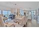 Open concept living room with hardwood floors, lots of natural light, and piano at 1820 Peachtree Nw St # 1008, Atlanta, GA 30309