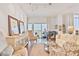 Inviting and elegant living room featuring plush seating, hardwood floors, and a grand piano at 1820 Peachtree Nw St # 1008, Atlanta, GA 30309