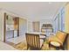Bright living room has white marble floors, mini bar, and a large window at 1820 Peachtree Nw St # 1008, Atlanta, GA 30309