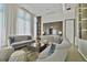 Comfortable living area featuring modern sofas, stylish coffee table, and sheer curtains allowing natural light to filter in at 1820 Peachtree Nw St # 1008, Atlanta, GA 30309