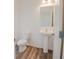 Clean powder room featuring a pedestal sink, modern fixtures, and neutral decor at 2117 Boxwood Se Cir, Conyers, GA 30094