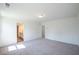 A spacious bedroom featuring neutral carpet, ample natural light, and ensuite bathroom access at 2117 Boxwood Se Cir, Conyers, GA 30094