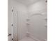 The minimalist shower has built-in shelving for convenience at 2117 Boxwood Se Cir, Conyers, GA 30094