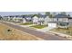 A new construction suburban neighborhood with sidewalks and front lawns on an overcast day at 2117 Boxwood Se Cir, Conyers, GA 30094