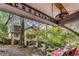 Inviting backyard view from the covered porch with a swing, lush landscaping, and a charming home exterior at 2287 Armand Ne Rd, Atlanta, GA 30324