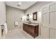 Bathroom featuring a double sink vanity, patterned tile flooring, and neutral wall paint at 2287 Armand Ne Rd, Atlanta, GA 30324