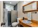 Bathroom featuring a unique wood vanity, modern fixtures and a tiled walk-in shower at 2287 Armand Ne Rd, Atlanta, GA 30324