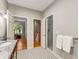 Bathroom showing a doorway, a glass door shower stall, and patterned tile flooring at 2287 Armand Ne Rd, Atlanta, GA 30324