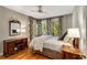 Bright bedroom featuring hardwood floors, neutral paint and many windows at 2287 Armand Ne Rd, Atlanta, GA 30324