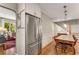 Open dining area with modern refrigerator, dining table and access to living room at 2287 Armand Ne Rd, Atlanta, GA 30324