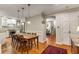 An open dining room next to the kitchen with hardwood floors and neutral wall color at 2287 Armand Ne Rd, Atlanta, GA 30324