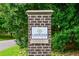 Elegant brick entrance sign for Lindridge Martin Manor with lush landscaping and a welcoming community feel at 2287 Armand Ne Rd, Atlanta, GA 30324