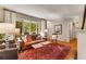 Comfortable living room featuring a large window with backyard view and neutral decor at 2287 Armand Ne Rd, Atlanta, GA 30324