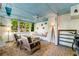Comfortable sunroom with brick floor, ceiling fan, and a built-in bench at 2287 Armand Ne Rd, Atlanta, GA 30324