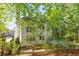 Back exterior with spacious deck and lush landscaping providing privacy at 3902 Concord Walk Se Dr, Smyrna, GA 30082