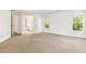 Spacious bedroom featuring neutral carpet, white walls, and an adjacent bathroom with double doors at 3902 Concord Walk Se Dr, Smyrna, GA 30082