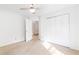 Bedroom with neutral carpet, closet, and a bright window providing natural light at 3902 Concord Walk Se Dr, Smyrna, GA 30082