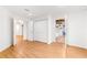 Bright bedroom featuring hardwood floors, double closet, and white trim at 3902 Concord Walk Se Dr, Smyrna, GA 30082
