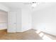 Bedroom featuring neutral carpet, chair-rail detail, and two doors for easy access at 3902 Concord Walk Se Dr, Smyrna, GA 30082