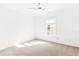 Bright bedroom with neutral carpet, ceiling fan, and a window at 3902 Concord Walk Se Dr, Smyrna, GA 30082