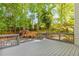 Spacious wooden deck overlooking the lush, green backyard and landscaping at 3902 Concord Walk Se Dr, Smyrna, GA 30082