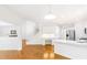 Open concept kitchen with stainless steel appliances, light wood floors and white cabinets at 3902 Concord Walk Se Dr, Smyrna, GA 30082