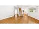 Spacious living room with hardwood floors and view into kitchen and dining area at 3902 Concord Walk Se Dr, Smyrna, GA 30082