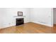 Cozy living room featuring a fireplace and hardwood floors at 3902 Concord Walk Se Dr, Smyrna, GA 30082