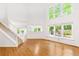 Open-concept living room with large windows offering lots of natural light at 3902 Concord Walk Se Dr, Smyrna, GA 30082