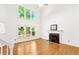 Bright living room featuring a fireplace, large windows, and hardwood floors at 3902 Concord Walk Se Dr, Smyrna, GA 30082