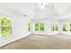 Spacious main bedroom with natural light, neutral carpet and vaulted ceilings at 3902 Concord Walk Se Dr, Smyrna, GA 30082