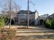 Expansive two-story home featuring a large backyard, and a multi-tiered outdoor living space at 12640 Hearthstone Way, Alpharetta, GA 30009