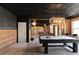 Partially finished basement with framed walls, a pool table, and plenty of space for activities at 12640 Hearthstone Way, Alpharetta, GA 30009