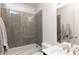 Bright bathroom with glass shower wall, white cabinets, and modern fixtures at 12640 Hearthstone Way, Alpharetta, GA 30009